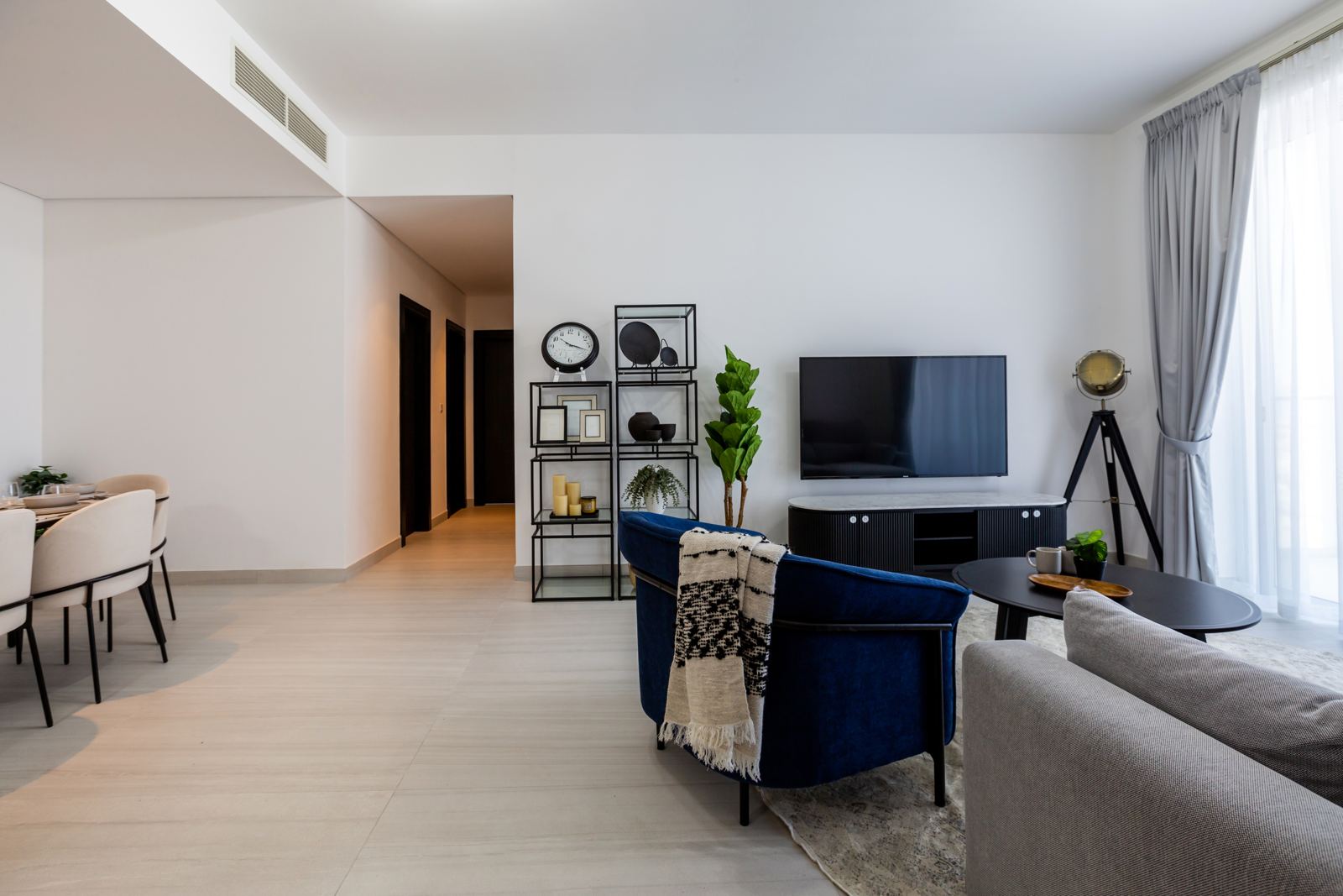 Open-plan living and dining room with hallway to the bedrooms